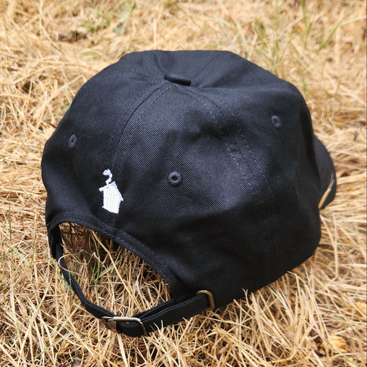 Black cap on dry grass