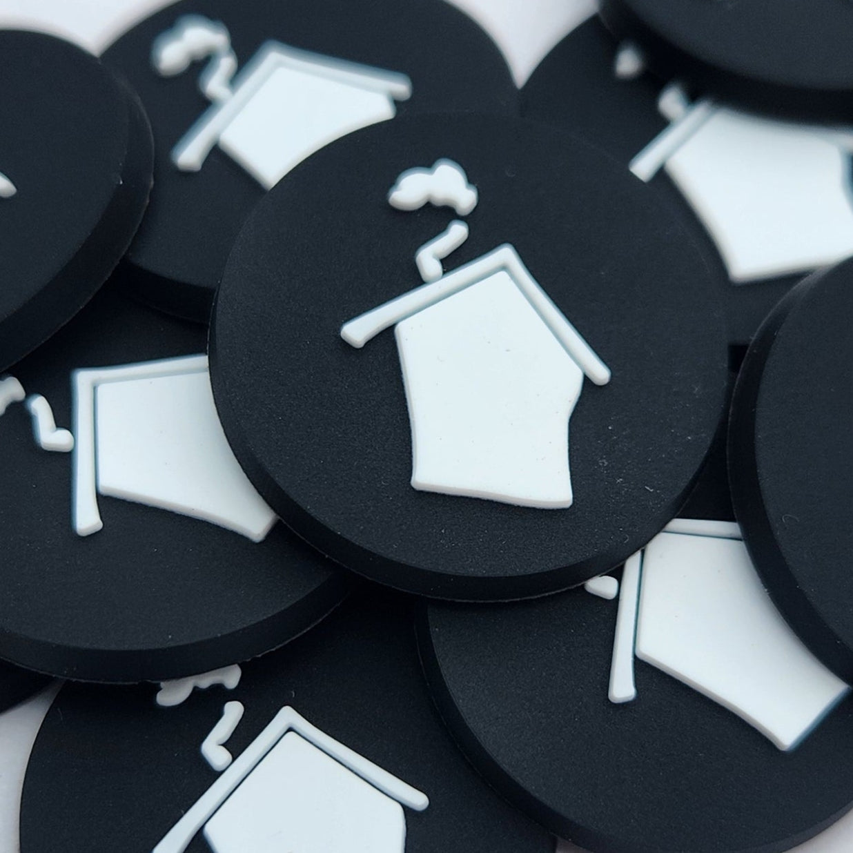 Black buttons with white icons on a white background